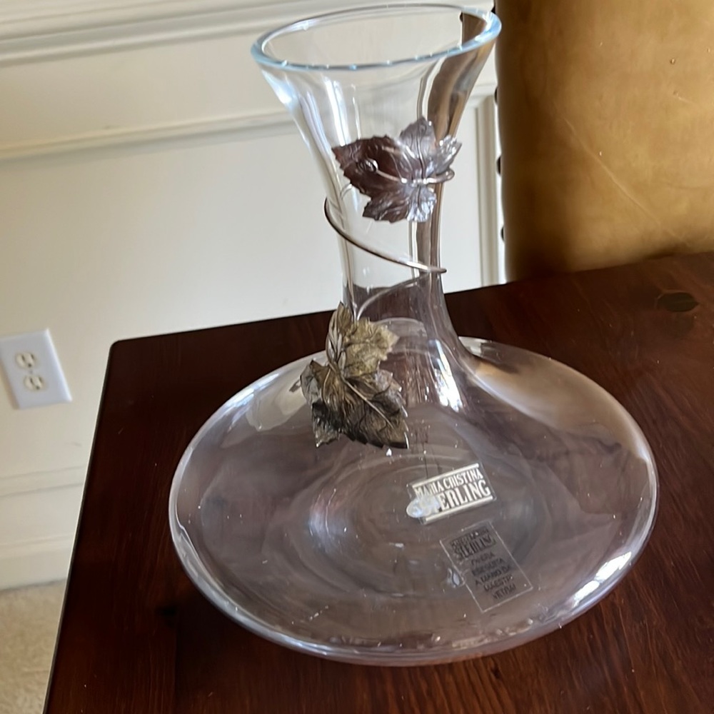 Glass decanter with sterling leaf details.  Made in Italy